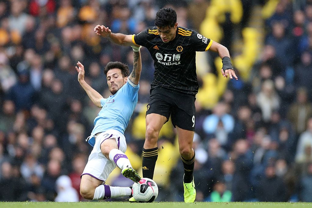 Soccer Football - Premier League - Manchester City v Wolverhampton Wanderers - Etihad Stadium, Manchester, Britain - October 6, 2019  Manchester City's David Silva in action with Wolverhampton Wanderers' Raul Jimenez    Action Images via Reuters/Carl Recine  EDITORIAL USE ONLY. No use with unauthorized audio, video, data, fixture lists, club/league logos or "live" services. Online in-match use limited to 75 images, no video emulation. No use in betting, games or single club/league/player publications.  Please contact your account representative for further details.
