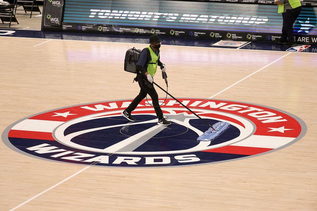 FILE PHOTO: Dec 19, 2020; Washington, DC, USA;   The floor is wiped down during halftime of the Washington Wizards and Detroit Pistons preseason game at Capital One Arena on December 19, 2020 in Washington, DC.  Mandatory Credit: Rob Carr/Pool Photo via USA TODAY Sports/File Photo