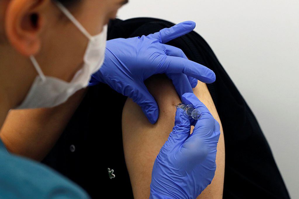 A volunteer is injected with an experimental Chinese coronavirus (COVID-19) vaccine as Turkey began final Phase III trials at Kocaeli University Research Hospital in Kocaeli, Turkey September, 25, 2020. REUTERS/Murad Sezer