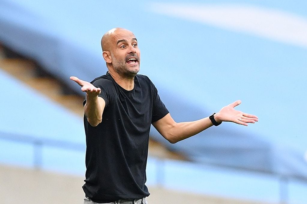Soccer Football - FA Cup Semi Final - Arsenal v Manchester City - Wembley Stadium, London, Britain - July 18, 2020 Manchester City manager Pep Guardiola reacts, as play resumes behind closed doors following the outbreak of the coronavirus disease (COVID-19) Justin Tallis/Pool via REUTERS