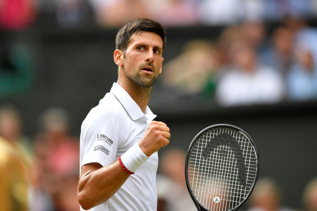Tennis - Wimbledon - All England Lawn Tennis and Croquet Club, London, Britain - July 12, 2019  Serbia's Novak Djokovic reacts during his semi-final match against Spain's Roberto Bautista Agut  REUTERS/Toby Melville
