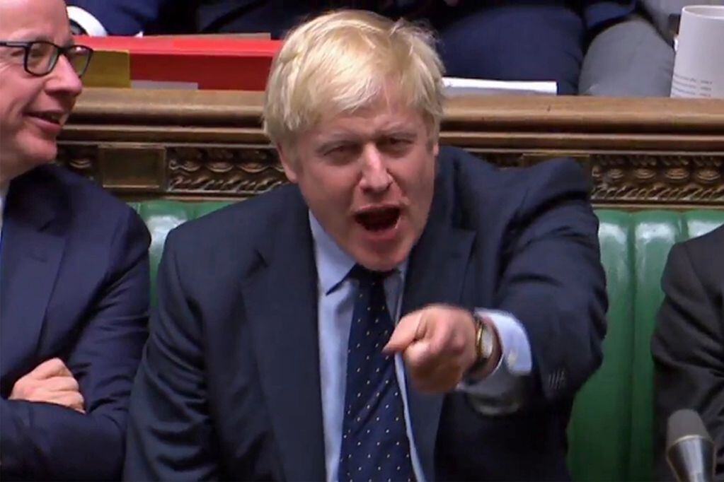 A video grab from footage broadcast by the UK Parliament's Parliamentary Recording Unit (PRU) shows Britain's Prime Minister Boris Johnson reacting to Britain's main opposition Labour Party leader Jeremy Corbyn's suggestion of waiting for the bill to pass before accepting a general election after the government's defeat on Standing Order 24, an emergency debate on a no-deal Brexit in the House of Commons in London on September 3, 2019. Prime Minister Boris Johnson suffered a major parliamentary defeat over his Brexit strategy on Tuesday, which could delay Britain's exit from the European Union next month and force an early election. - RESTRICTED TO EDITORIAL USE - MANDATORY CREDIT " AFP PHOTO / PRU " - NO USE FOR ENTERTAINMENT, SATIRICAL, MARKETING OR ADVERTISING CAMPAIGNS - EDITORS NOTE THE IMAGE HAS BEEN DIGITALLY ALTERED AT SOURCE TO OBSCURE VISIBLE DOCUMENTS
 / AFP / PRU / - / RESTRICTED TO EDITORIAL USE - MANDATORY CREDIT " AFP PHOTO / PRU " - NO USE FOR ENTERTAINMENT, SATIRICAL, MARKETING OR ADVERTISING CAMPAIGNS - EDITORS NOTE THE IMAGE HAS BEEN DIGITALLY ALTERED AT SOURCE TO OBSCURE VISIBLE DOCUMENTS

