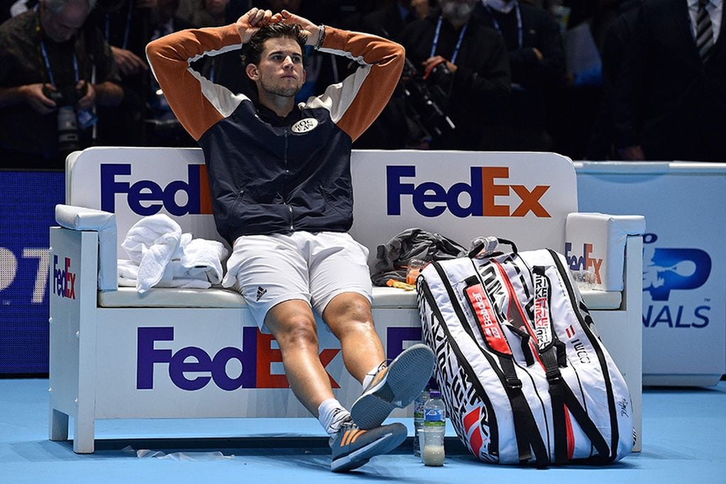 Austria's Dominic Thiem reacts as he waits for the trophy presentation to start, after losing the men's singles final match on day eight of the ATP World Tour Finals tennis tournament at the O2 Arena in London on November 17, 2019. Greece's Stefanos Tsitsipas beat Austria's Dominic Thiem to win the match 6-7, 6-2, 7-6. / AFP / Glyn KIRK                          

