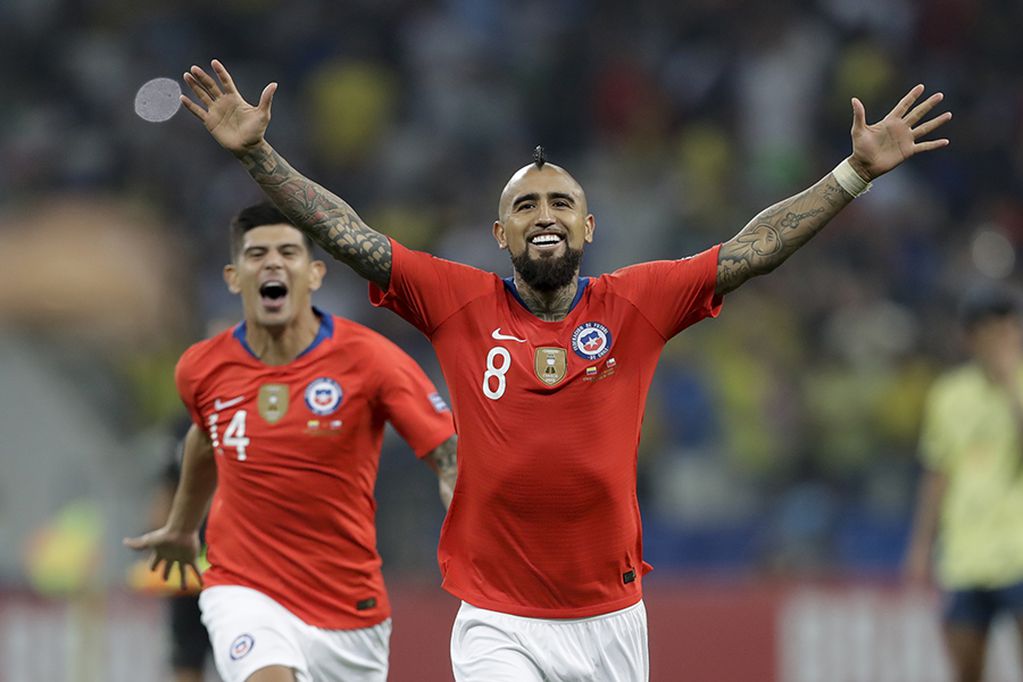 Chile's Arturo Vidal celebrates after beating Colombia on penalties in a Copa America quarterfinal soccer match at the Arena Corinthians in Sao Paulo, Brazil, Friday, June 28, 2019. Chile won 5-4 on penalties after the match ended 0-0 and qualified to ...