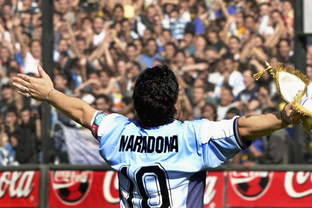 (FILES) In this file photo taken on November 09, 2001 Argentinian football star Diego Maradona greets the public in the "La Bombonera" stadium of Boca Juniors Athletic club in Buenos Aires. - Argentinian football legend Diego Maradona passed away on November 25, 2020. (Photo by ALI BURAFI / AFP)