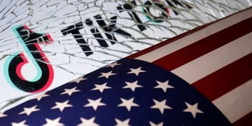 Illustration shows U.S. flag, TikTok logo and broken glass
