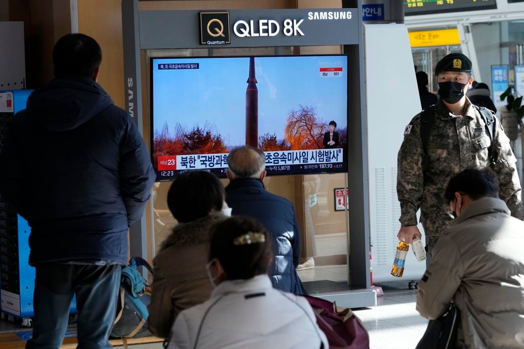People watch a TV showing an image of North Korea's missile launch during a news program at the Seoul Railway Station in Seoul, South Korea, Thursday, Jan. 6, 2022. North Korea said Thursday it has successfully launched a hypersonic missile as part of efforts to modernize its strategic weapons systems, days after leader Kim Jong Un vowed to bolster his military forces despite pandemic-related difficulties. The Korean letters read "North Korea launched a hypersonic missile." (AP Photo/Ahn Young-joon)