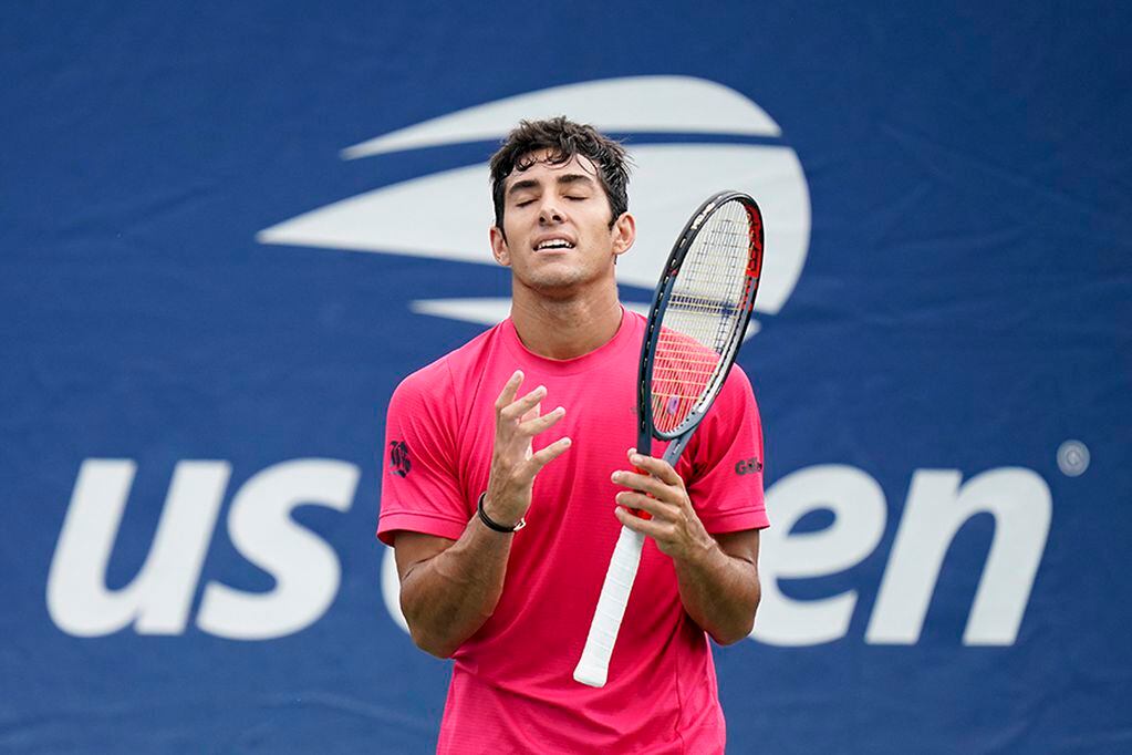 Cristian Garin, of Chile, reacts during a match against Mikhail Kukushkin, of Kazakhstan, during the second round of the US Open tennis championships, Wednesday, Sept. 2, 2020, in New York. (AP Photo/Seth Wenig)