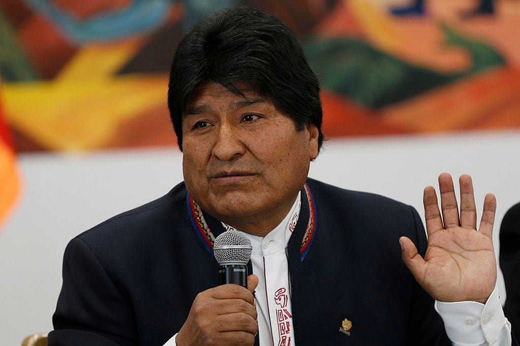 Bolivia's President Evo Morales speaks during a meeting with Organization of American States delegates at the presidential palace in La Paz, Bolivia, Tuesday, Oct. 22, 2019. Rioting broke out in parts of Bolivia among opponents of Morales after electoral authorities announced that a resumed vote count after a day-long delay put the leader close to avoiding a runoff in his bid for a fourth term. (AP Photo/Juan Karita)