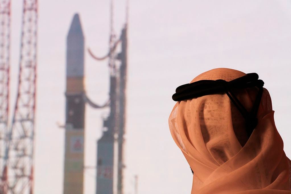 An Emirati man prepares to watch the launch of the "Amal" or "Hope" space probe at the Mohammed bin Rashid Space Center in Dubai, United Arab Emirates, Monday, July 20, 2020. A United Arab Emirates spacecraft, the "Amal" or "Hope" probe, blasted off to Mars from Japan early Monday, starting the Arab world's first interplanetary trip. (AP Photo/Jon Gambrell)