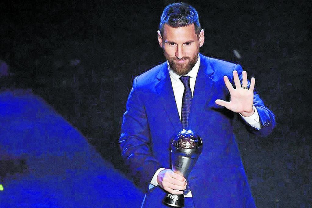 Argentina and Barcelona forward Lionel Messi reacts after winning the trophy for the Best FIFA Men's Player of 2019 Award, during The Best FIFA Football Awards ceremony, on September 23, 2019 in Milan.
 / AFP / Marco Bertorello

