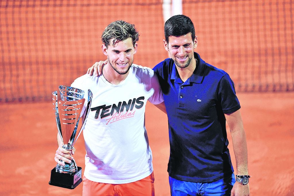 Austrian tennis player Dominic Thiem poses for a photo with Serbian tennis player Novak Djokovic after winning the final match against Serbian tennis player Filip Krajinovic at the Adria Tour, Novak Djokovic's Balkans charity tennis tournament in Belgrade on June 14, 2020. - The ATP and WTA Tours have been suspended since March due to the COVID-19 pandemic and will not resume at least until the end of July 2020. (Photo by Andrej ISAKOVIC / AFP)