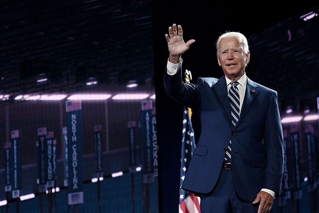 Former vice-president and Democratic presidential nominee Joe Biden waves on stage at the end of the third day of the Democratic National Convention, being held virtually amid the novel coronavirus pandemic, at the Chase Center in Wilmington, Delaware on August 19, 2020. (Photo by Olivier DOULIERY / AFP)