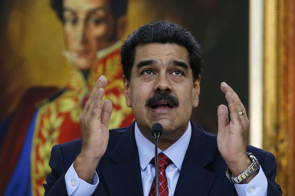FILE - In this file photo dated Friday, Jan. 25, 2019, Venezuelan President Nicolas Maduro gives a press conference at Miraflores presidential palace in Caracas, Venezuela. More than a week into a standoff with the opposition, Venezuelan President Nicolas Maduro said Wednesday Jan. 30, 2019, that he is willing to negotiate with opposition leader Juan Guaido. (AP Photo/Ariana Cubillos, FILE) Venezuela