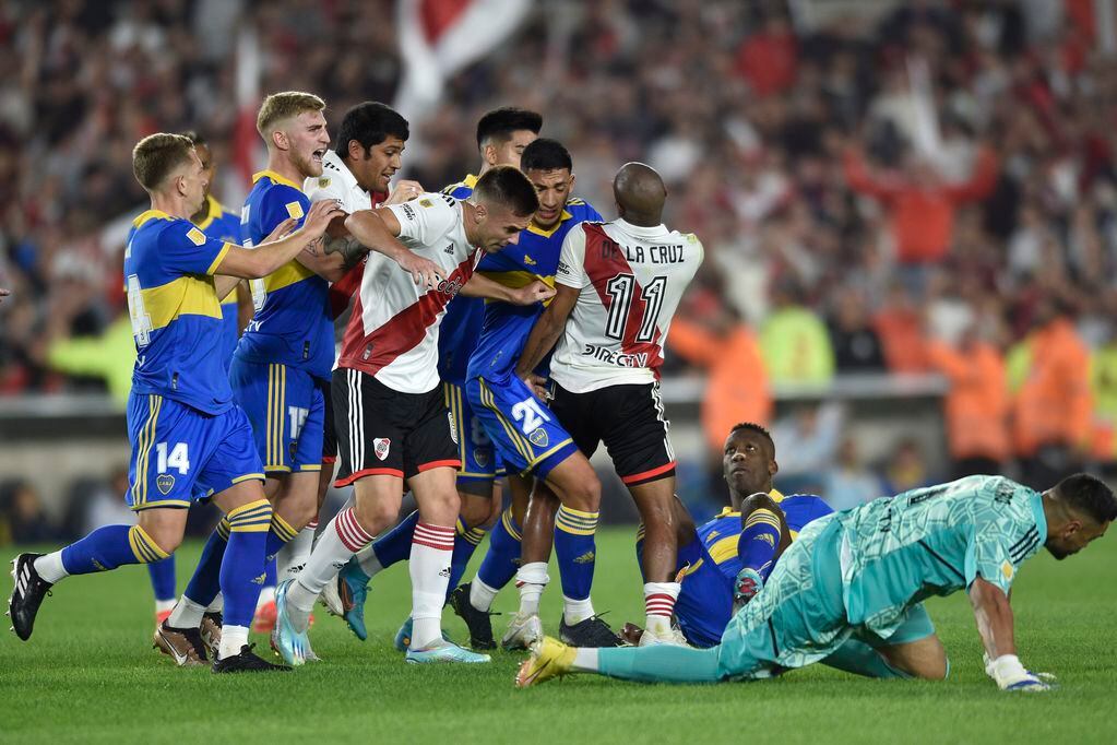 Players of River Plate and Boca Juniors fight during a local tournament soccer match at Monumental stadium in Buenos Aires, Argentina, Sunday, May 7, 2023.(AP Photo/Gustavo Garello)