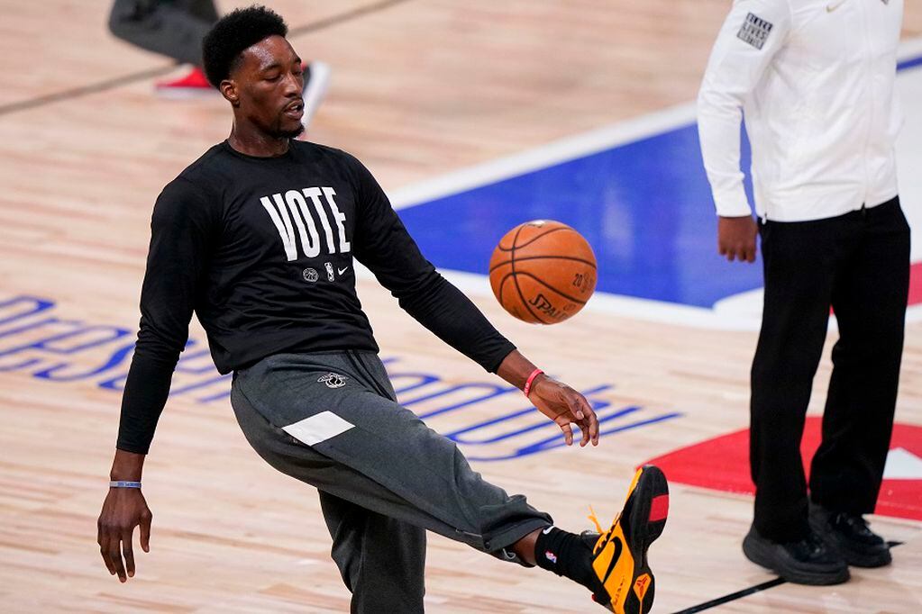 Miami Heat forward Bam Adebayo warms up before Game 4 of basketball's NBA Finals against the Los Angeles Lakers Tuesday, Oct. 6, 2020, in Lake Buena Vista, Fla. (AP Photo/Mark J. Terrill)