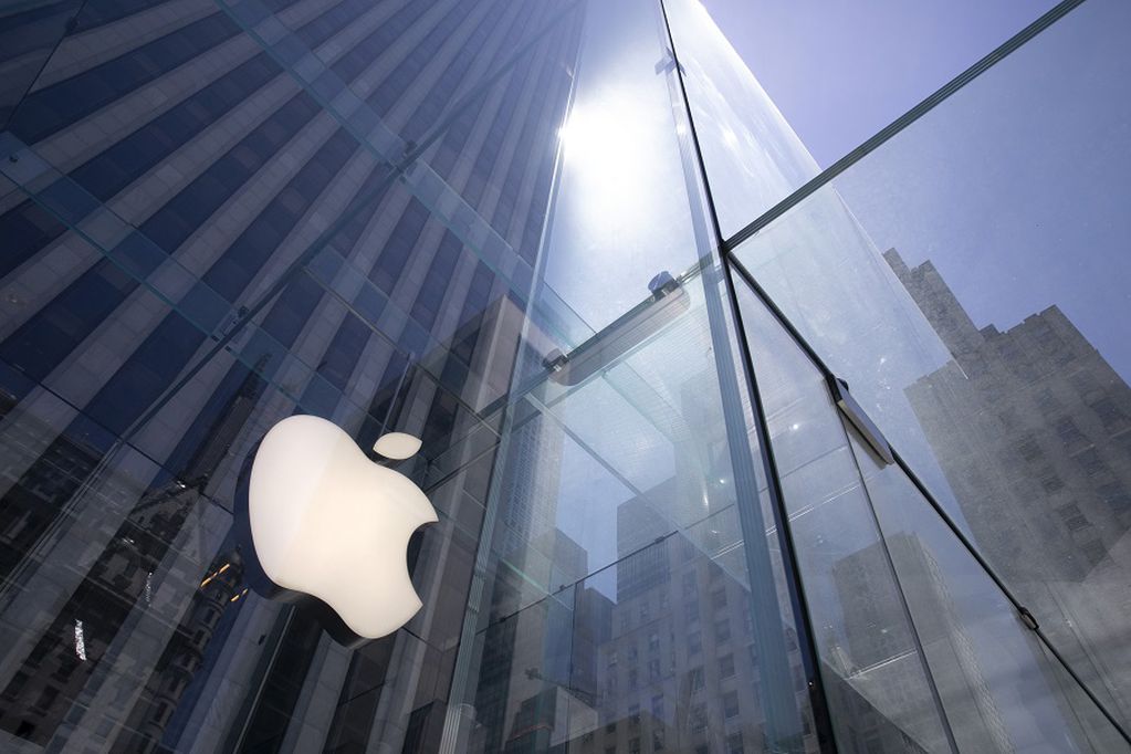 FILE - In this June 16, 2020, file photo, the sun is reflected on Apple's Fifth Avenue store in New York. Apple is delaying a new privacy feature in the next version of its iPhone operating system that will make it more difficult for app developers to track people online to help sell ads. (AP Photo/Mark Lennihan, File)