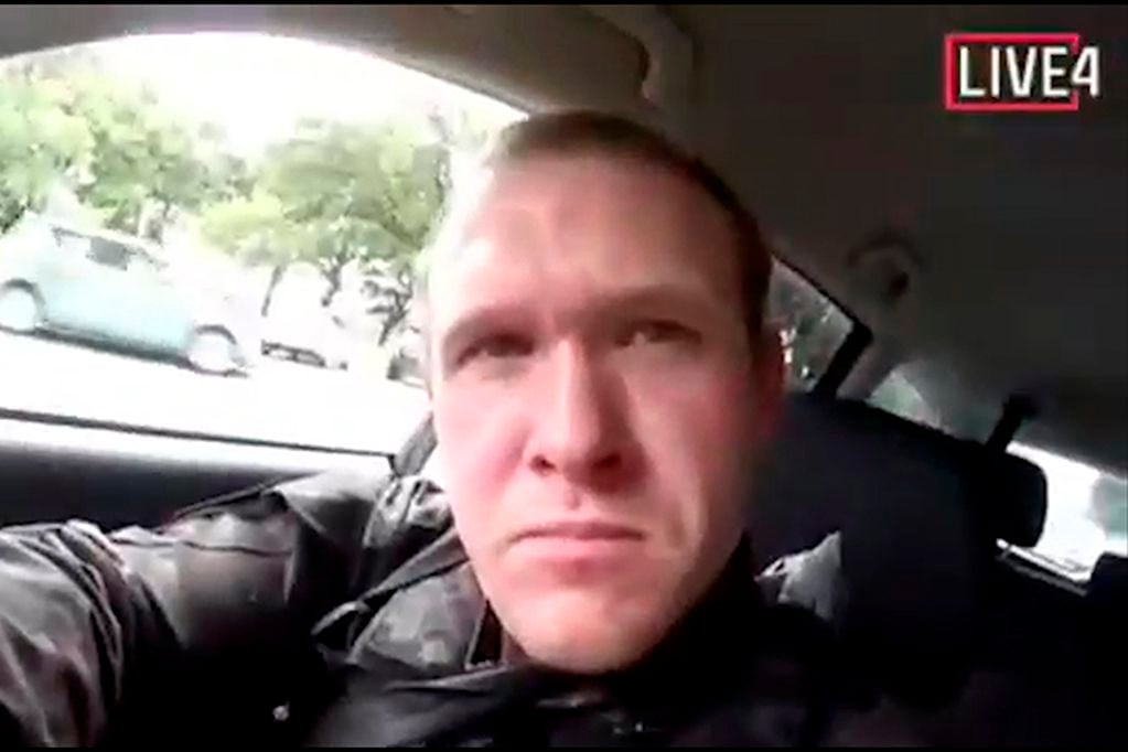 This image taken from the alleged shooter's video, which was filmed Friday, March 15, 2019, shows him as he drives and he looks over to three guns on the passenger side of his vehicle in New Zealand. A witness says many people have been killed in a mas...