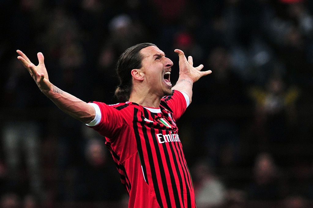 (FILES) In this file photo taken on February 15, 2012 AC Milan's Swedish forward Zlatan Ibrahimovic kicks and score a penalty during the UEFA Champions League round of 16 first leg match AC Milan vs Arsenal at San Siro stadium in Milan. - Swedish star Zlatan Ibrahimovic has signed a six-month contract with Serie A side AC Milan with the option of an additional year, the Italian club said in a statement on December 27, 2019. Ibrahimovic played for two seasons between 2010 and 2012 with Milan, helping them to their last Serie A title. The 38-year-old left Los Angeles Galaxy last month following the club's elimination from the Major League Soccer playoffs. (Photo by Giuseppe CACACE / AFP)