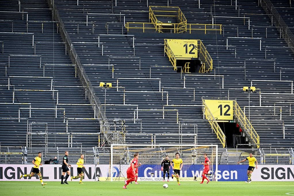 FILE PHOTO: Soccer Football - Bundesliga - Borussia Dortmund v Bayern Munich - Signal Iduna Park, Dortmund, Germany - May 26, 2020 General view inside the stadium during the match, as play resumes behind closed doors following the outbreak of the coronavirus disease (COVID-19) Federico Gambarini/Pool via REUTERS  DFL regulations prohibit any use of photographs as image sequences and/or quasi-video/File Photo