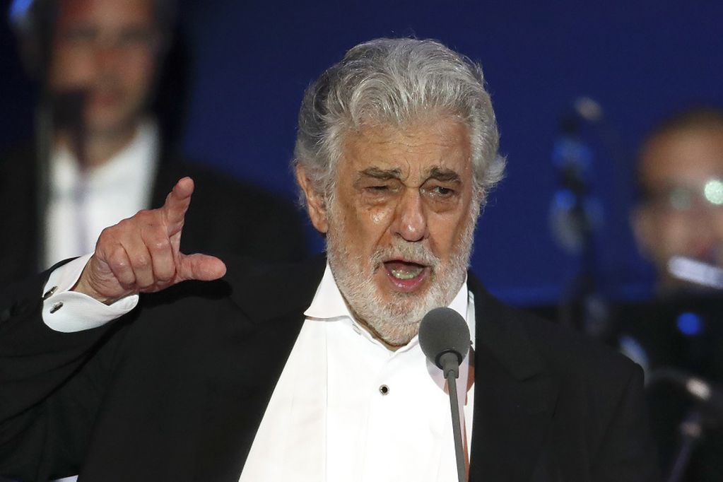 FILE - In this Aug. 28, 2019, file photo, opera singer Placido Domingo performs during a concert in Szeged, Hungary. Domingo is back in Europe to receive a lifetime achievement award after recovering from the coronavirus, vowing in an interview with a top Italian daily newspaper to clear his name from allegations of sexual misconduct. The opera legend’s appearance Thursday, Aug. 6, 2020, to accept the award from the Austria Music Theater will be his first in public since recovering from the virus at his home in Acapulco, Mexico.  (AP Photo/Laszlo Balogh, File)