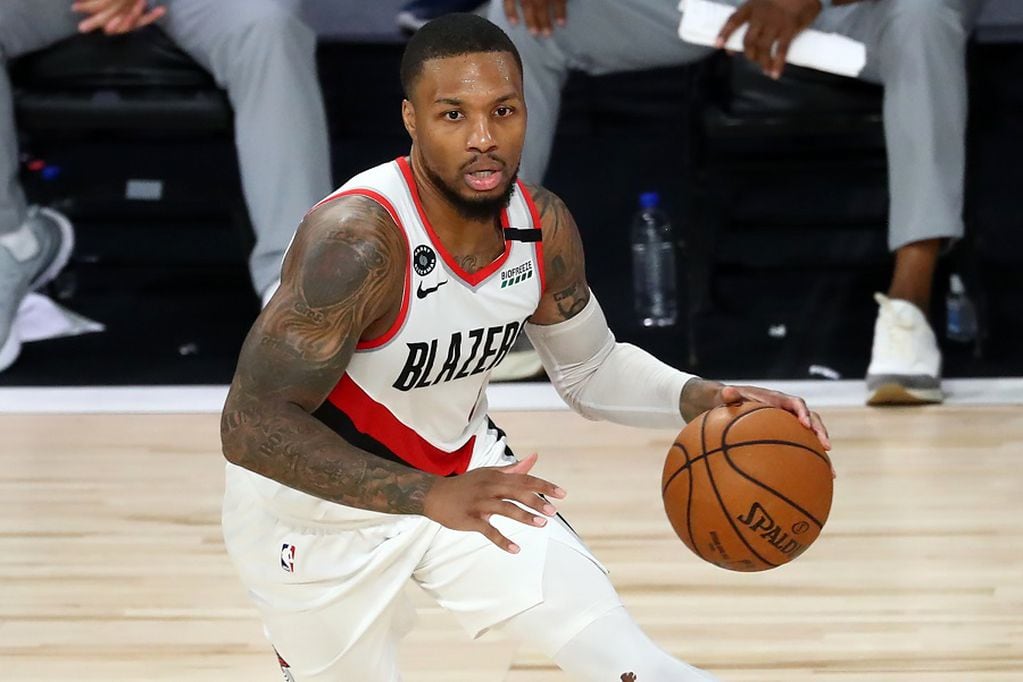 Aug 8, 2020; Lake Buena Vista, Florida, USA;  Portland Trail Blazers guard Damian Lillard (0) dribbles during the second half against the LA Clippers in an NBA basketball game at The Field House. Mandatory Credit: Kim Klement-USA TODAY Sports