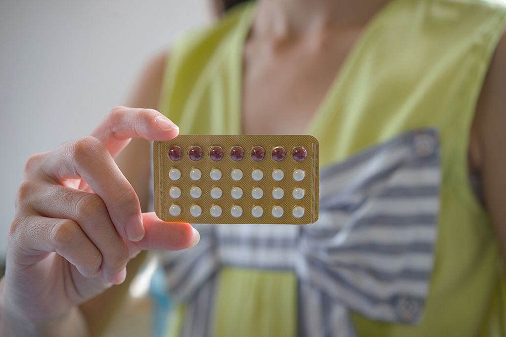 Woman hand holding a contraceptive panel prevent pregnancy
