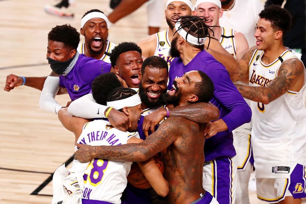 Oct 11, 2020; Lake Buena Vista, Florida, USA; The Los Angeles Lakers celebrate their win over the Miami Heat after game six of the 2020 NBA Finals at AdventHealth Arena. The Los Angeles Lakers won 106-93 to win the series. Mandatory Credit: Kim Klement-USA TODAY Sports     TPX IMAGES OF THE DAY