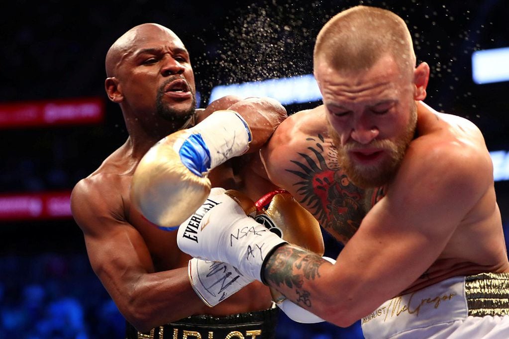 FILE PHOTO: Aug 26, 2017; Las Vegas, NV, USA; Floyd Mayweather Jr. lands a hit against Conor McGregor during their boxing match at the at T-Mobile Arena. Mandatory Credit: Mark J. Rebilas-USA TODAY Sports/File Photo