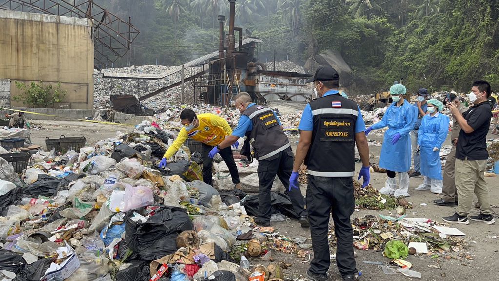 Thai police forensic officers investigate a garbage dump site as they search for parts of the body of a Colombian surgeon in Koh Phagnan island, southern Thailand, Friday, Aug. 4, 2023. Daniel Sancho Bronchalo, the son of two Spanish film stars, has been arrested in Thailand on suspicion of murdering and dismembering Edwin Arrieta Arteaga on a tourist island, police said. Sancho was taken from Koh Phagnan, where the remains of the Colombian surgeon were found, to another island, Samui, where he is being held, Surat Thani provincial police commander Saranyu Chamnanrat said Tuesday. (AP Photo/Somkeat Ruksaman)