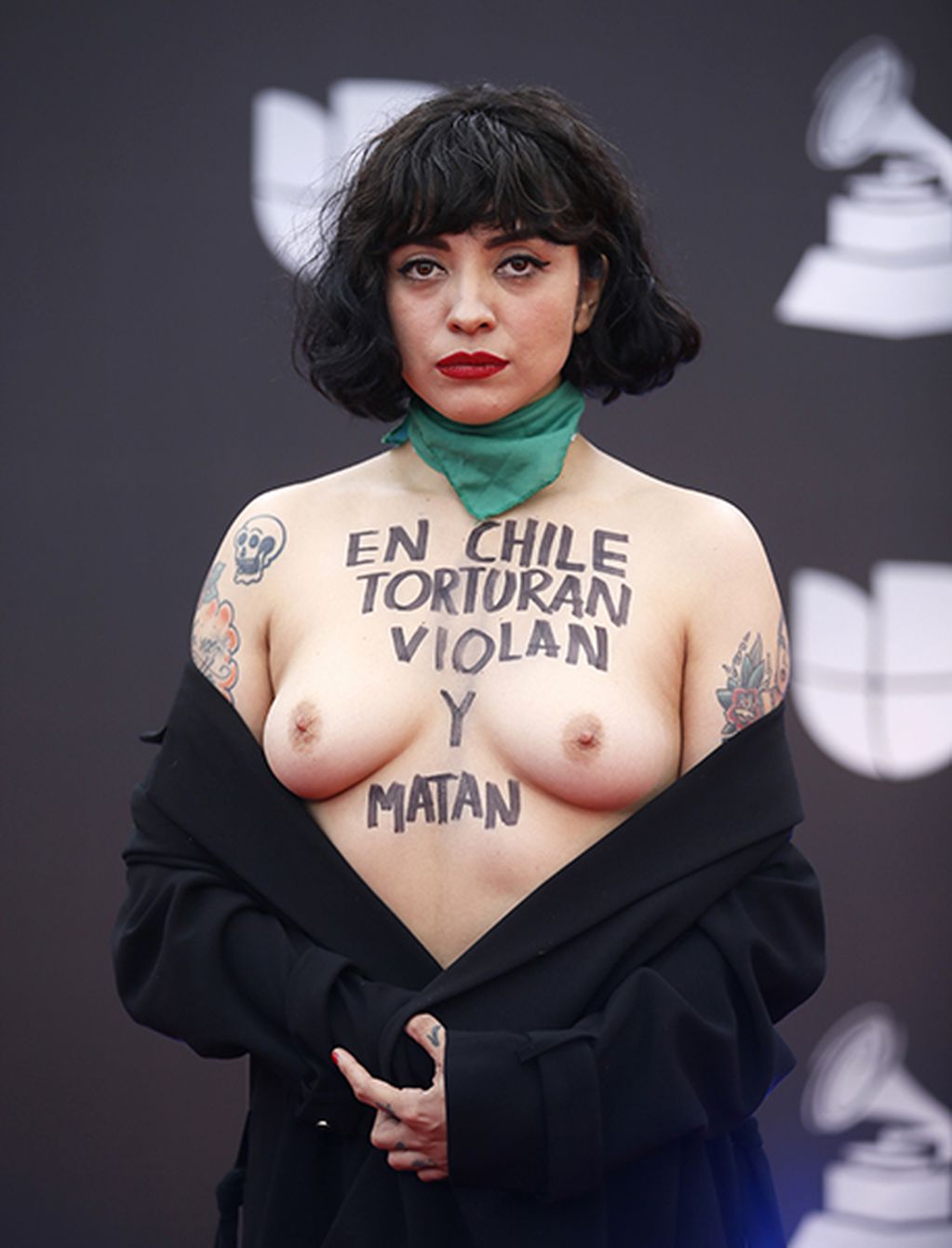 SENSITIVE MATERIAL. THIS IMAGE MAY OFFEND OR DISTURB. The 20th Annual Latin Grammy Awards - Arrivals - Las Vegas, Nevada, U.S., November 14, 2019 - Mon Laferte wears the message "In Chile they torture rape and kill" on her body. REUTERS/Danny Moloshok SENSITIVE MATERIAL. THIS IMAGE MAY OFFEND OR DISTURB.