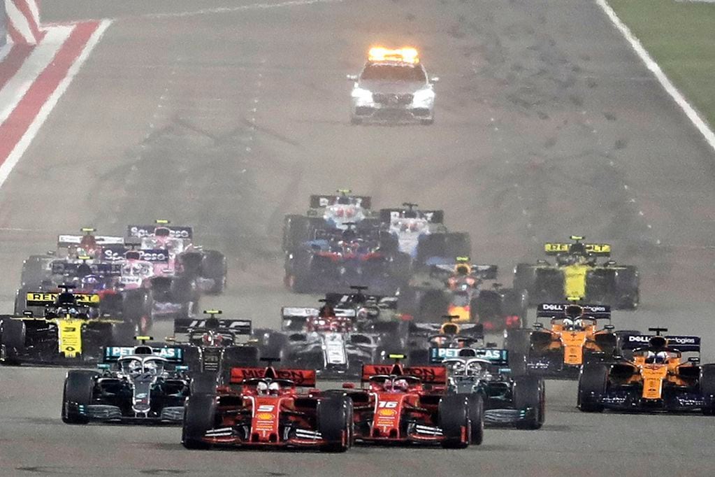 FILE - In this Sunday, March 31, 2019 file photo, Ferrari driver Charles Leclerc of Monaco, center right, and Ferrari driver Sebastian Vettel of Germany, center left, steer their cars during the start of the Baharain Formula One Grand Prix at the Bahrain International Circuit in Sakhir, Bahrain.  Saudi Arabia says it will host a Formula One race starting next year.  The kingdom says on Thursday, Nov. 5, 2020,  it will host the race in November 2021 in the Red Sea city of Jiddah. (AP Photo/Hassan Ammar, File)