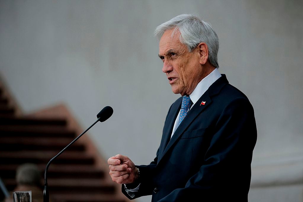 Chilean president Sebastian Pinera speaks during a press conference at La Moneda Presidential Palace in Santiago on August 04, 2019. Chile's President Sebastian Pinera rejected on Wednesday the allusion made by his Brazilian counterpart Jair Bolsonaro over UN rights chief Michelle Bachelet's father. The leftist former Chile president was "following Macron's line," Bolsonaro tweeted, later taunting Bachelet by praising Augusto Pinochet's 1970s dictatorship in Chile, under which both she and her father were tortured. / AFP / JAVIER TORRES

