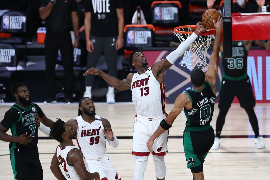Sep 15, 2020; Lake Buena Vista, Florida, USA; Miami Heat forward Bam Adebayo (13) blocks a shot by Boston Celtics forward Jayson Tatum (0) during overtime in game one of the Eastern Conference Finals of the 2020 NBA Playoffs at ESPN Wide World of Sports Complex. Mandatory Credit: Kim Klement-USA TODAY Sports