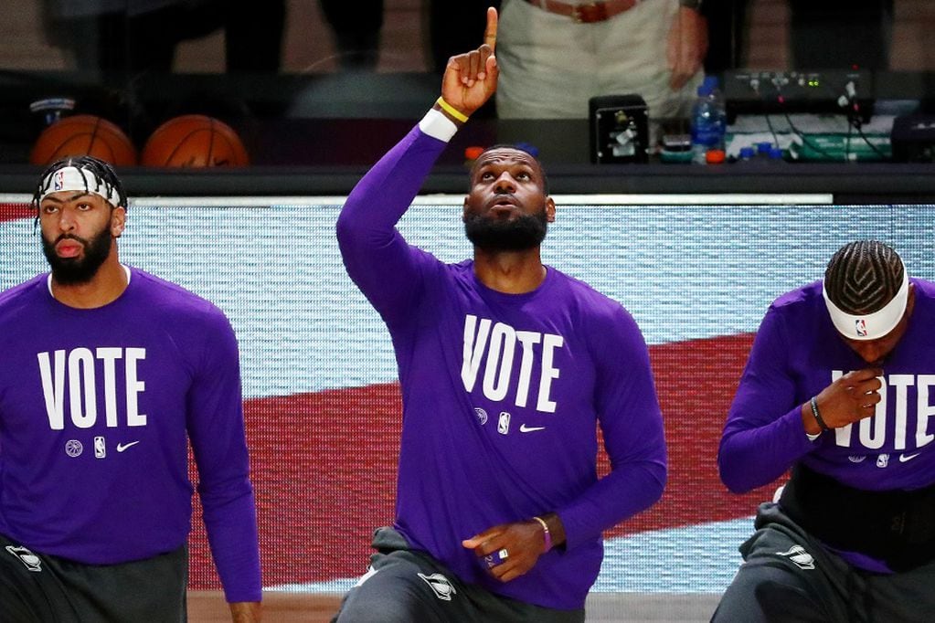 Oct 4, 2020; Orlando, Florida, USA; Los Angeles Lakers forward LeBron James (23) points upwards during the national anthem before game three of the 2020 NBA Finals against the Miami Heat at AdventHealth Arena. Mandatory Credit: Kim Klement-USA TODAY Sports