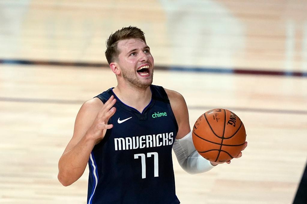 Dallas Mavericks' Luka Doncic (77) reacts after being called for a foul against the Los Angeles Clippers during the first half of an NBA basketball first round playoff game Sunday, Aug. 23, 2020, in Lake Buena Vista, Fla. (AP Photo/Ashley Landis, Pool)