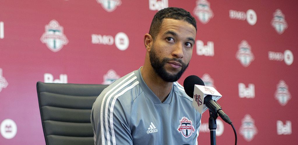 FILE - In this Nov. 13, 2019, file photo, Toronto FC soccer player Justin Morrow speaks to the media during an end of season availability in Toronto. A group of African American Major League Soccer players have formed a coalition to address systematic racism in their communities and bring about change within the league. The coalition is the result of an Instagram group formed after the death of George Floyd at the hands of Minneapolis police, which spawned a wave of nationwide protests against racism and policy brutality. Started by Toronto FC defender Justin Morrow, the group grew to some 70 MLS players, who decided to act and the Black Players Coalition of MLS was born. (Chris Young/The Canadian Press via AP, File)