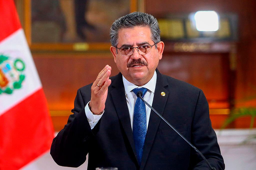 Handout picture released by the Peruvian Presidency showing Peruvian interim president Manuel Merino announcing his resignation in a televised message from the Government Palace, on November 15, 2020. - Peru's President Manuel Merino resigned on Sunday...