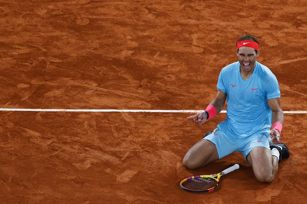 Spain's Rafael Nadal celebrates after winning against Serbia's Novak Djokovic at the end of their men's final tennis match at the Philippe Chatrier court on Day 15 of The Roland Garros 2020 French Open tennis tournament in Paris on October 11, 2020. (Photo by Thomas SAMSON / AFP)