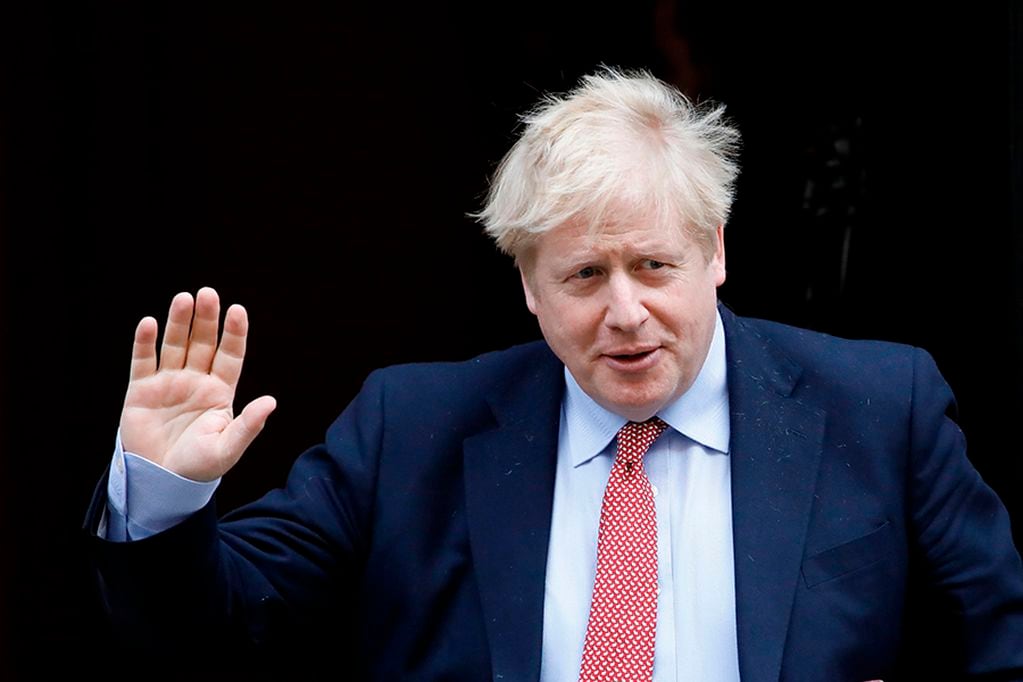 (FILES) In this file photo taken on March 25, 2020 Britain's Prime Minister Boris Johnson leaves number 10 Downing Street in central London on March 18, 2020, on his way to the House of Commons to attend Prime Minister's Questions (PMQs) - British Prime Minister Boris Johnson was taken to hospital on April 5, 2020 for tests, his office said, 10 days after he tested positive for coronavirus. Johnson, 55, announced he had mild symptoms of COVID-19 on March 27 and had been in self-isolation at his Downing Street residence for seven days. (Photo by Tolga AKMEN / AFP)