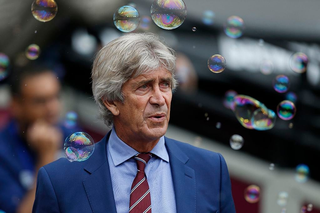 West Ham United's Chilean manager Manuel Pellegrini blows bubbles before the start of the English Premier League football match between West Ham United and Manchester United at The London Stadium, in east London on September 22, 2019. RESTRICTED TO EDITORIAL USE. No use with unauthorized audio, video, data, fixture lists, club/league logos or 'live' services. Online in-match use limited to 120 images. An additional 40 images may be used in extra time. No video emulation. Social media in-match use limited to 120 images. An additional 40 images may be used in extra time. No use in betting publications, games or single club/league/player publications.
 / AFP / Ian KINGTON / RESTRICTED TO EDITORIAL USE. No use with unauthorized audio, video, data, fixture lists, club/league logos or 'live' services. Online in-match use limited to 120 images. An additional 40 images may be used in extra time. No video emulation. Social media in-match use limited to 120 images. An additional 40 images may be used in extra time. No use in betting publications, games or single club/league/player publications.

