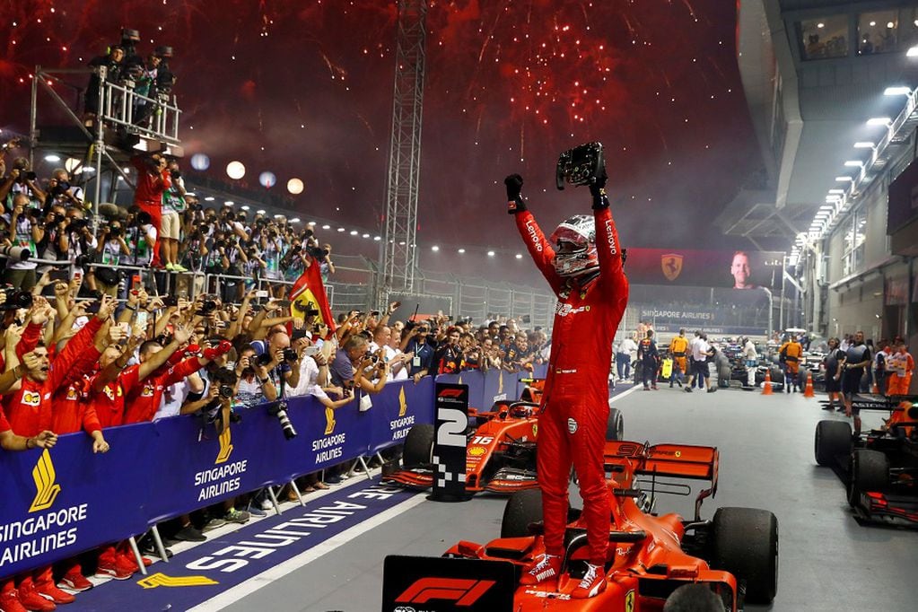 FILE PHOTO: Formula One F1 - Singapore Grand Prix - Marina Bay Street Circuit, Singapore - September 22, 2019  Ferrari's Sebastian Vettel celebrates after winning the race  REUTERS/Thomas Peter/File Photo