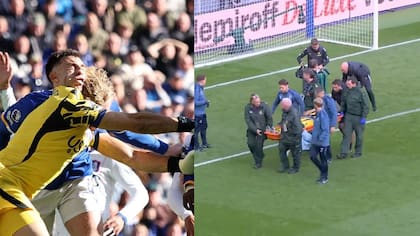 Dibu Martínez tuvo que salir en camilla de la cancha tras recibir impactante golpe
