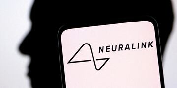 FILE PHOTO: Illustration shows Neuralink logo and Elon Musk silhouette