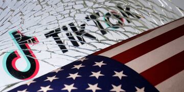 Illustration shows U.S. flag, TikTok logo and broken glass