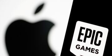FILE PHOTO: Smartphone with Epic Games logo is seen in front of Apple logo in this illustration