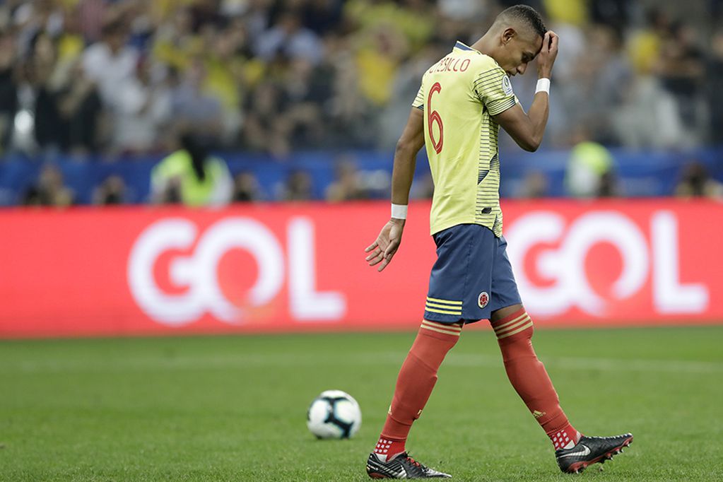 Colombia's William Tesillo looks down after missing to score during a penalty kick shoot-out against Chile in a Copa America quarterfinal soccer match at the Arena Corinthians in Sao Paulo, Brazil, Friday, June 28, 2019. Chile beat Colombia 5-4 on pena...
