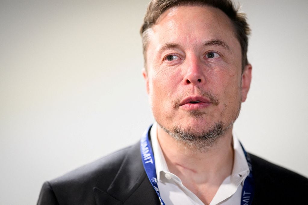 FILE PHOTO: Tesla, X (formerly known as Twitter) and SpaceX's CEO Elon Musk speaks with members of the media during the AI Safety Summit at Bletchley Park in Bletchley, Britain on November 1, 2023.  Leon Neal/Pool via REUTERS/File Photo