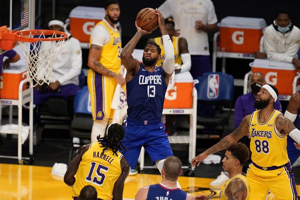 Los Angeles Clippers guard Paul George (13) shoots against the Los Angeles Lakers during the second half of an NBA basketball game Tuesday, Dec. 22, 2020, in Los Angeles. (AP Photo/Marcio Jose Sanchez)