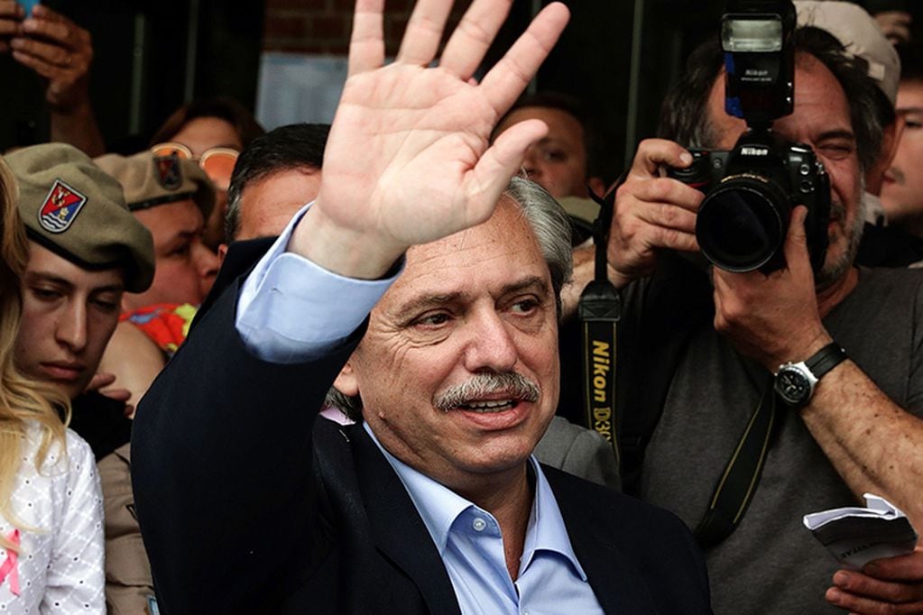 Argentina's presidential candidate for the Frente de Todos party Alberto Fernandez waves his supporters as he arrives at a polling station in Buenos Aires during Argentina's general election on October 27, 2019. Polls opened early Sunday for Argentina's 34 million registered voters in an election in which Fernandez -- the main opposition candidate -- is widely tipped in opinion polls to obtain the 45 percent of votes needed to secure an outright victory in the first round. / AFP / ALEJANDRO PAGNI

